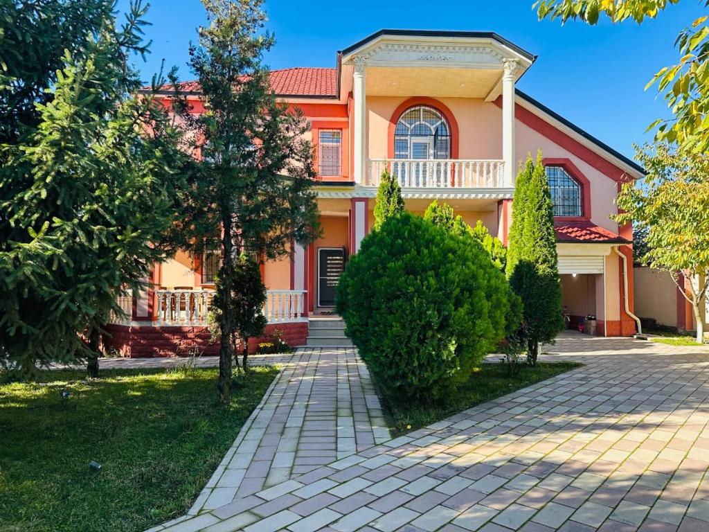 a house with a red roof and a driveway at Quba Village Villa in Quba