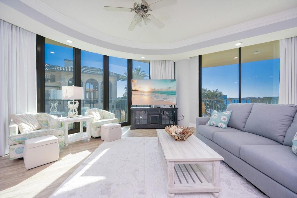 a living room with a couch and a table at Phoenix on the Bay 1134 condo in Caswell