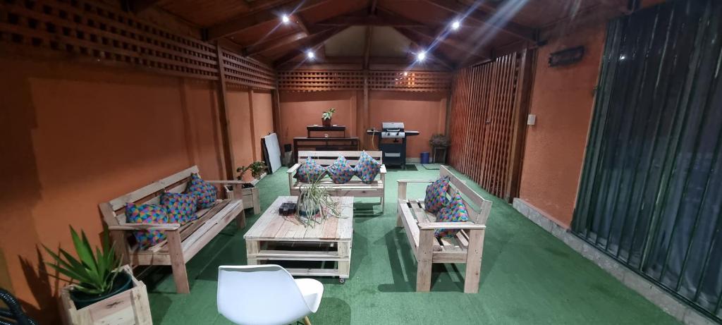 a room with tables and chairs in a building at Gran casa copiapo hasta 10 personas in Copiapó