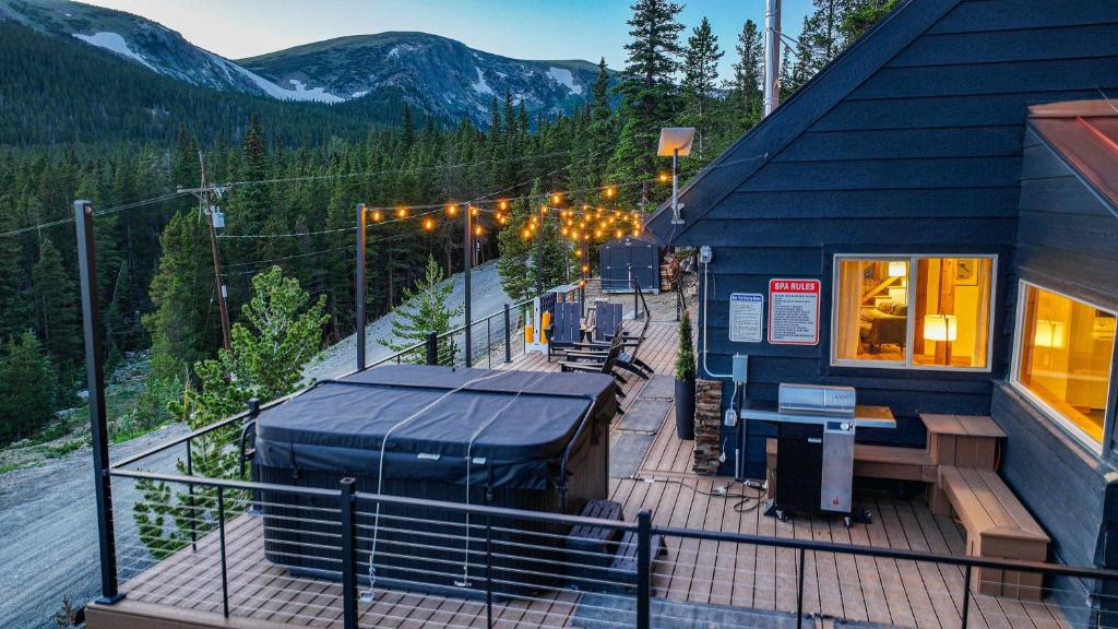 a blue building with a deck with a ski lift at Skyline Lodge in Ninetyfour