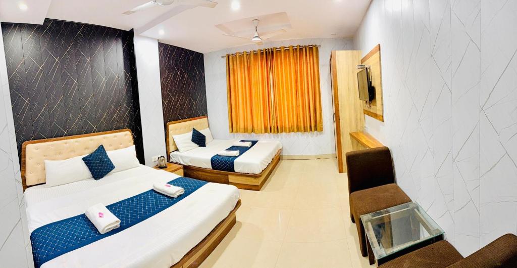 Ένα ή περισσότερα κρεβάτια σε δωμάτιο στο Hotel Manish International