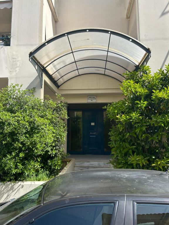 a car parked in front of a building at Cozy apartment in the heart of Tripoli! in Tripoli