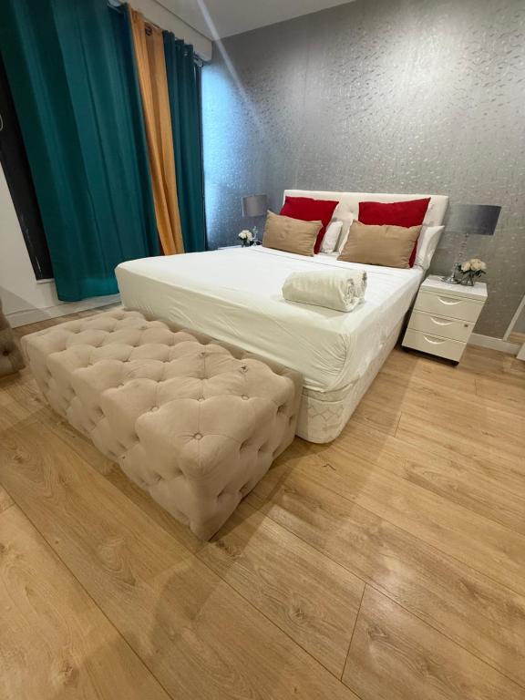 a bedroom with a large bed with a large ottoman at Gre Hostel San Benito in Madrid