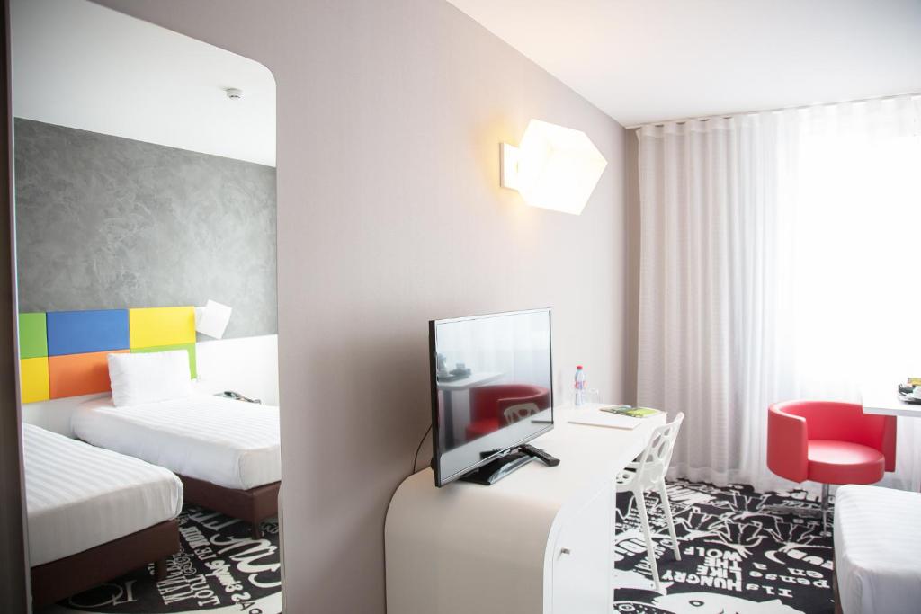 Postel nebo postele na pokoji v ubytování Hotel Tristar
