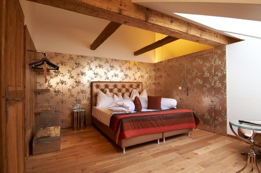Łóżko lub łóżka w pokoju w obiekcie Hotel Landhaus Moserhof