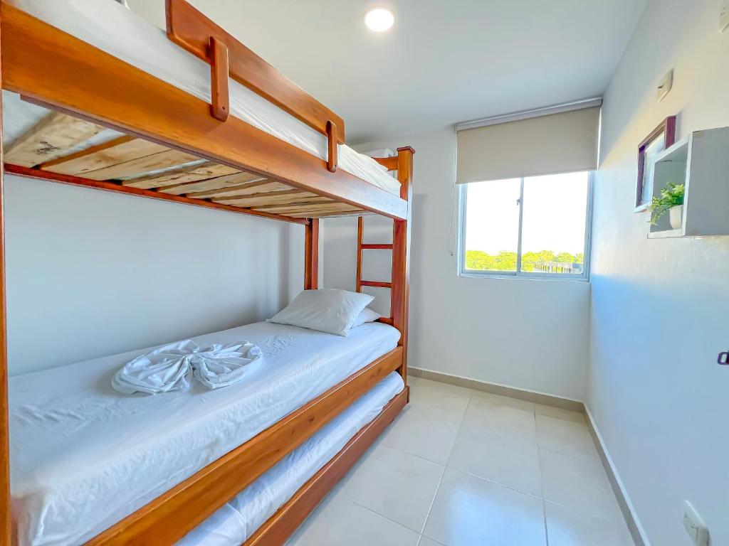 Postel nebo postele na pokoji v ubytování Olas Caribe 401