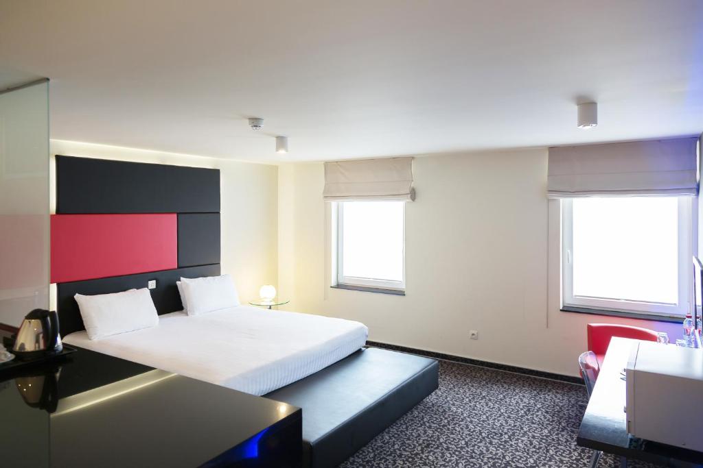 Postel nebo postele na pokoji v ubytování Hotel Tristar