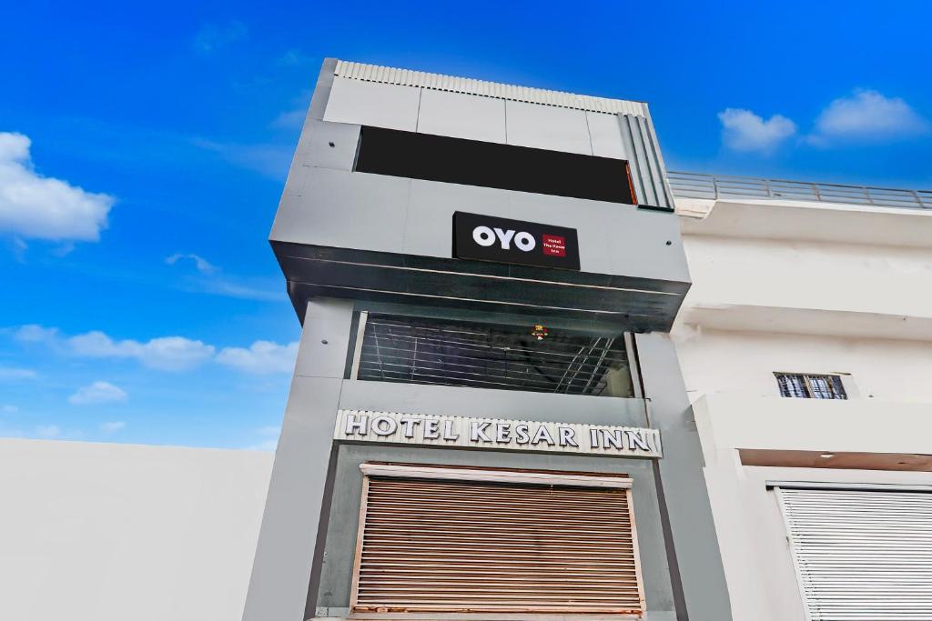 a hotel kazakhapestiki sign on the side of a building at Hotel O The Kesar Inn in Lucknow