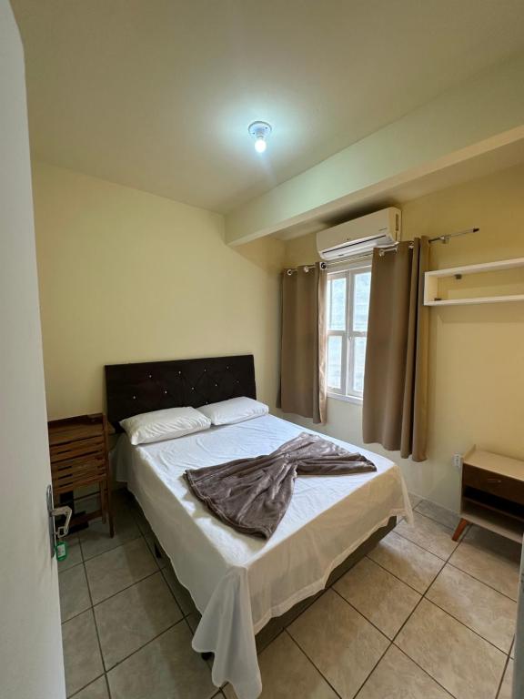 Ένα ή περισσότερα κρεβάτια σε δωμάτιο στο Vila das Dunas - Santinho