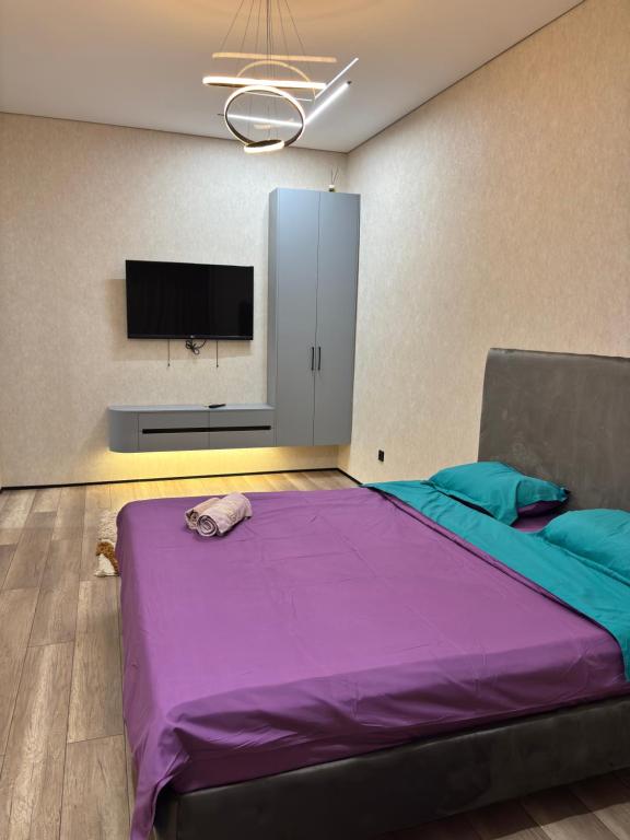 Postel nebo postele na pokoji v ubytování Квартира