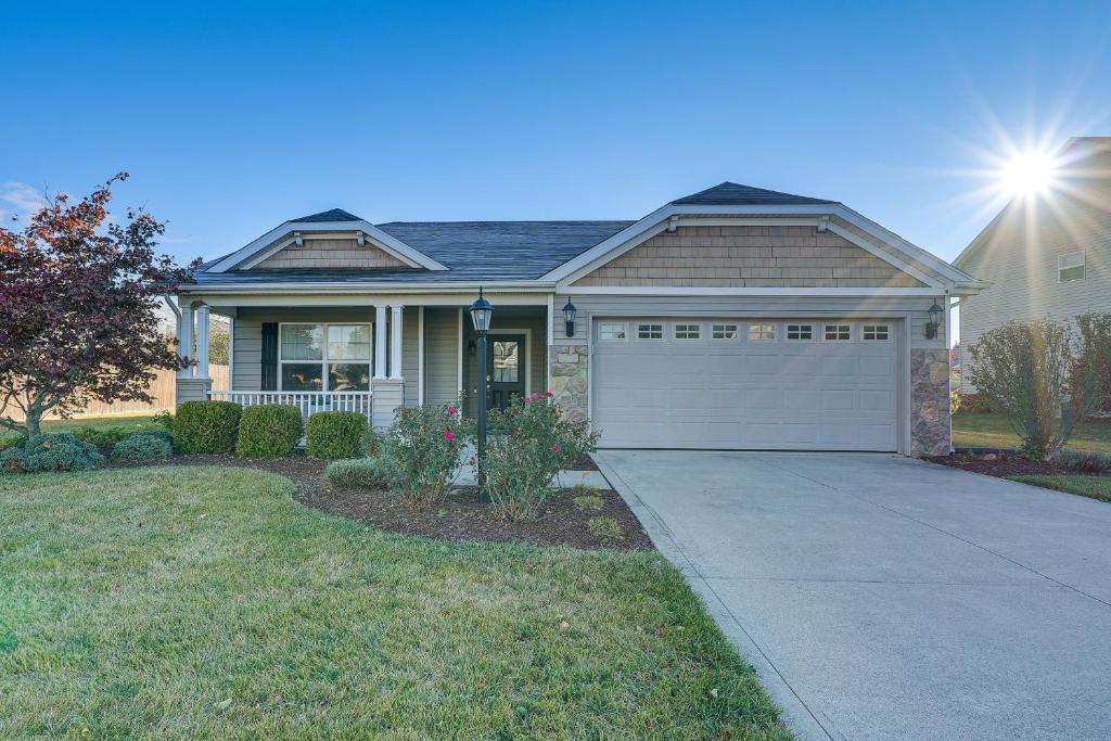 a house with a garage and a driveway at Private Yard and Pond Views Fort Wayne Family Home! in Arcola