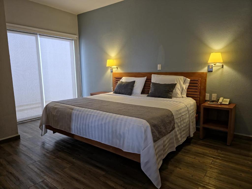 Postel nebo postele na pokoji v ubytování Quinta María Hotel Boutique & Spa