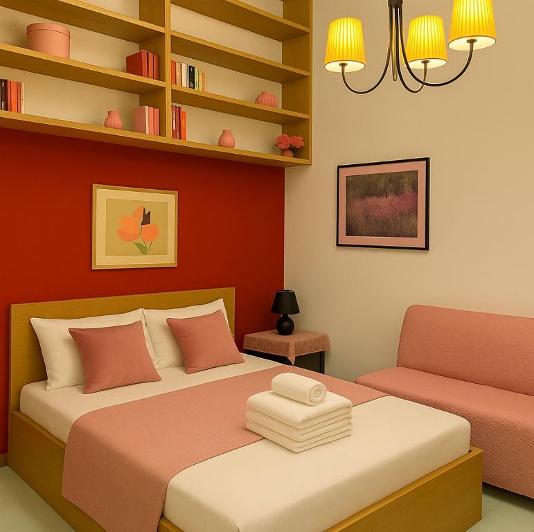 a bedroom with a bed and a chair at REALE COLOSSEO TREVI HOME - private garden in Rome