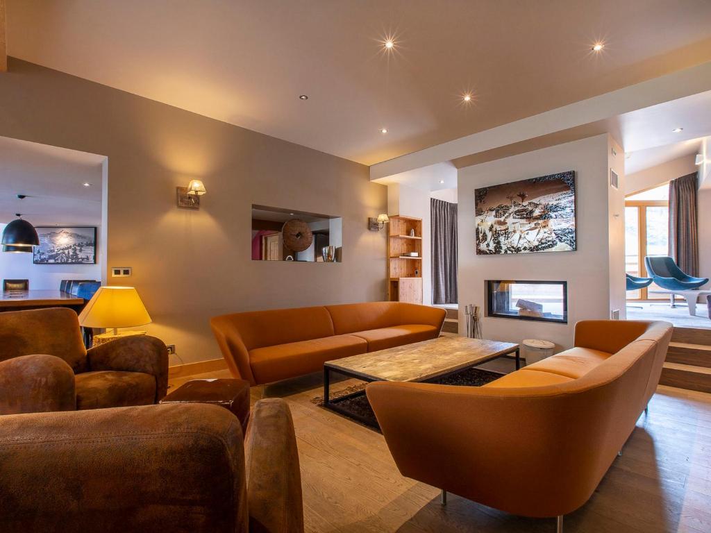 a living room with couches and a table at Chalet d'exception à Avoriaz, 16 pers, sauna, home cinéma, salle de fitness, services inclus - FR-1-314-95 in Morzine