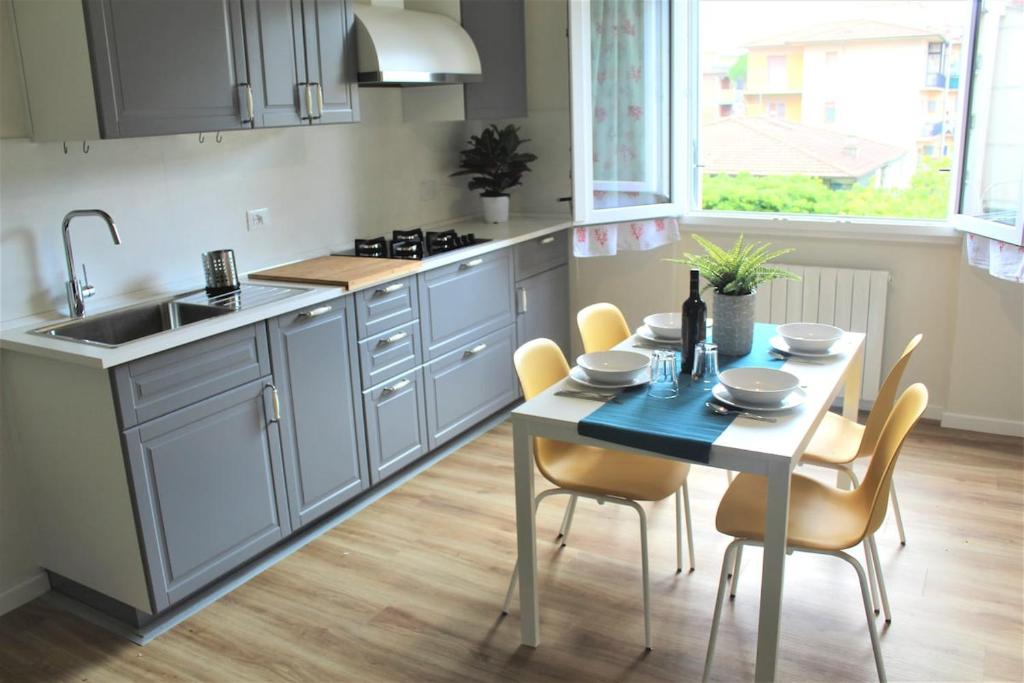 a kitchen with a table and chairs and a sink at Delicious next to Florence in Scandicci