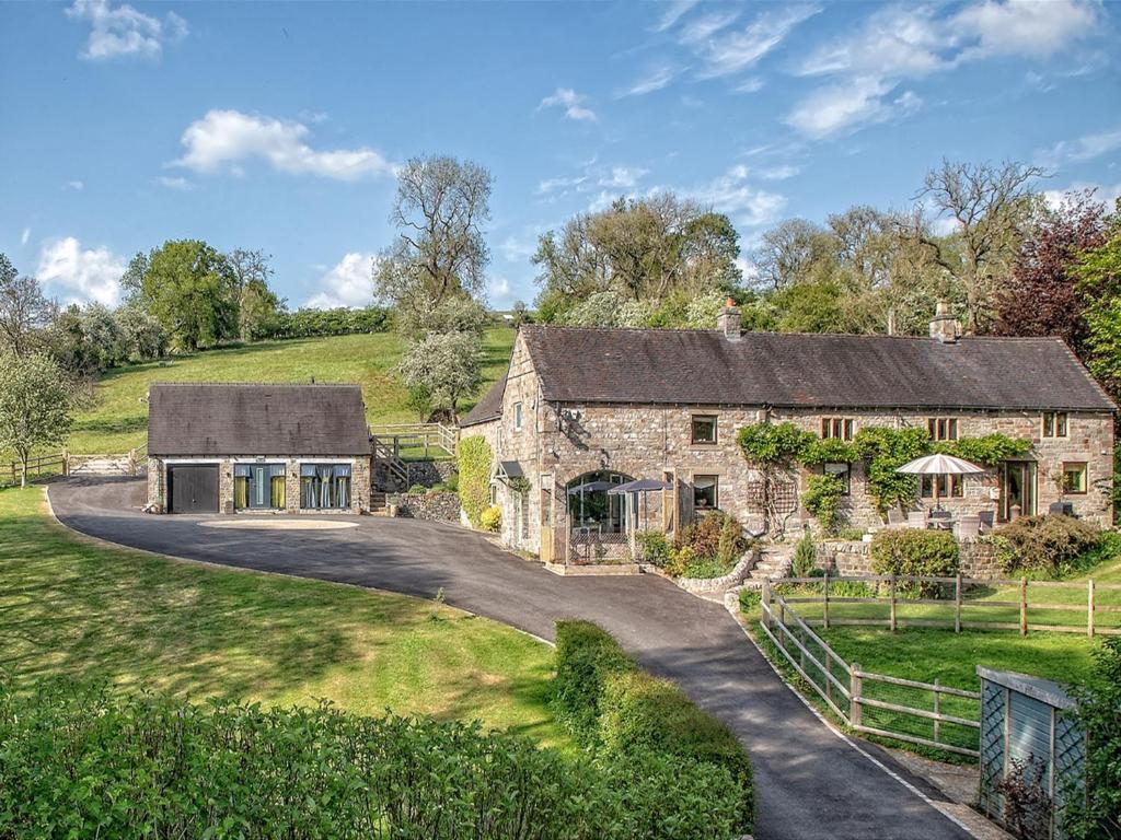 an old stone house with a driveway at 1 Bed in Waterfall 89733 in Waterhouses