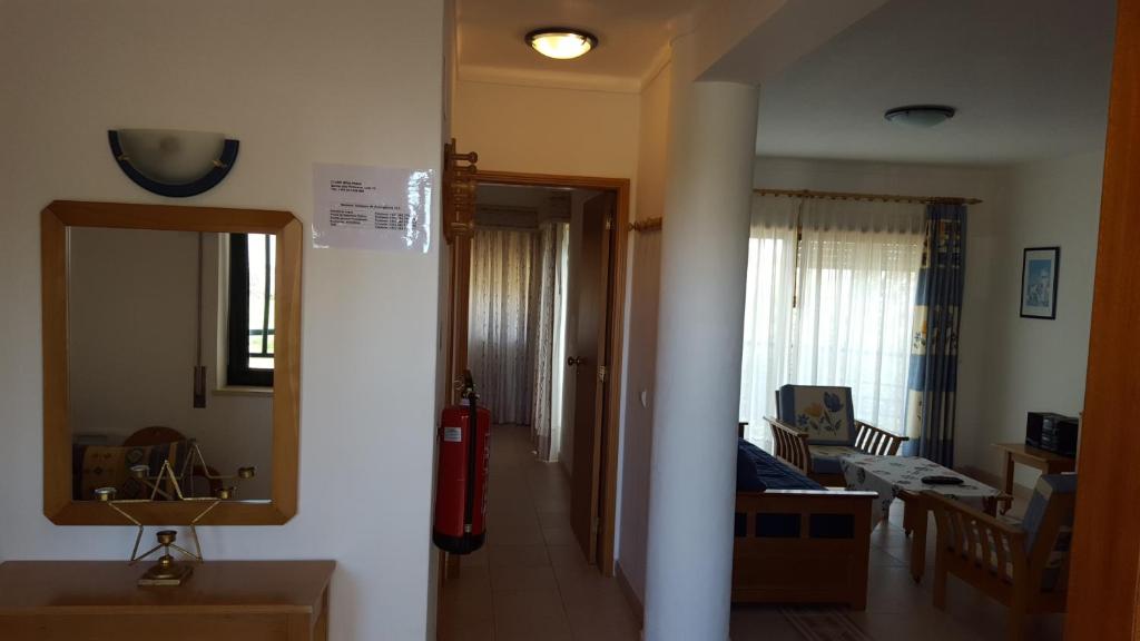 a hallway leading to a room with a living room at Clube Meia Praia in Lagos