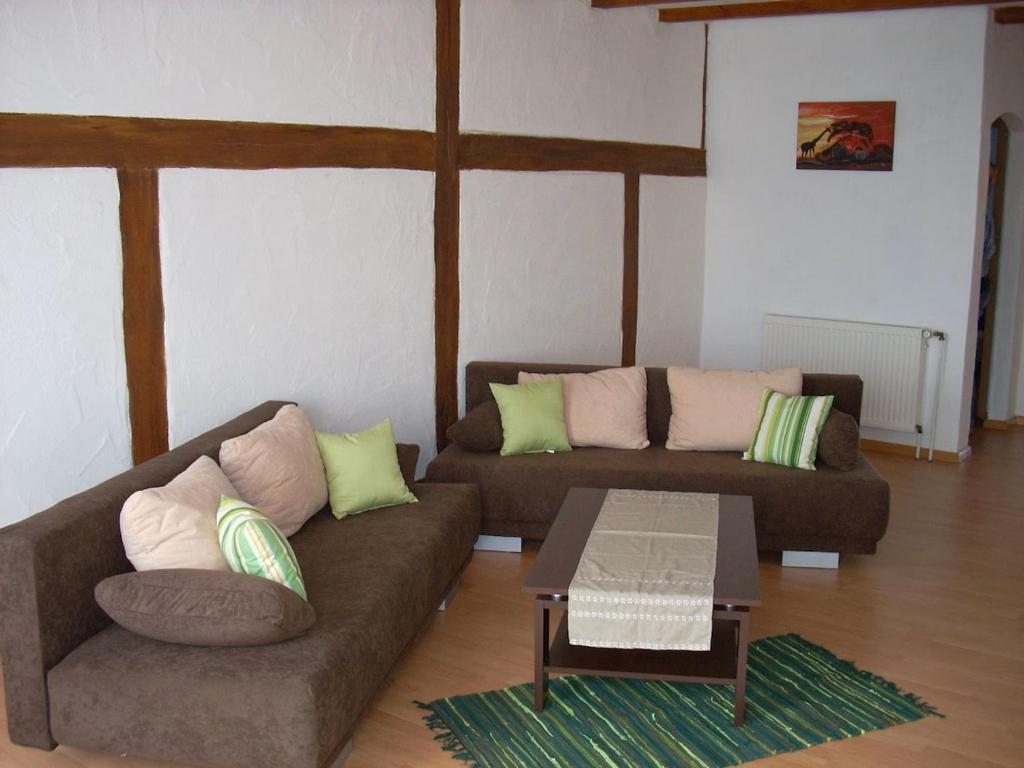 a living room with two couches and a coffee table at Gemütliche Ferienwohnung nähe Wutachschlucht in Hüfingen