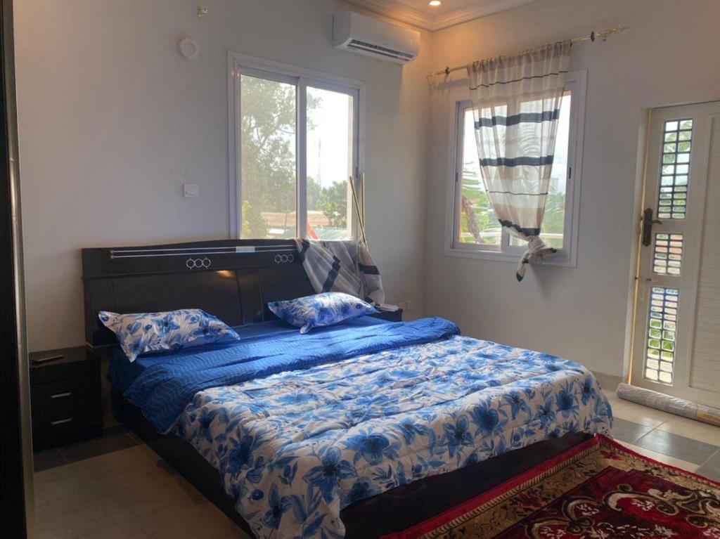 Postel nebo postele na pokoji v ubytování Kebbeh Apartments