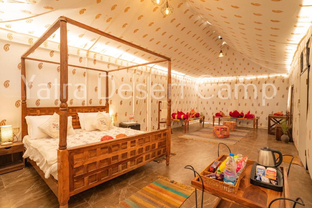 a bedroom with a canopy bed in a room at Yatra Desert Resort in Jaisalmer