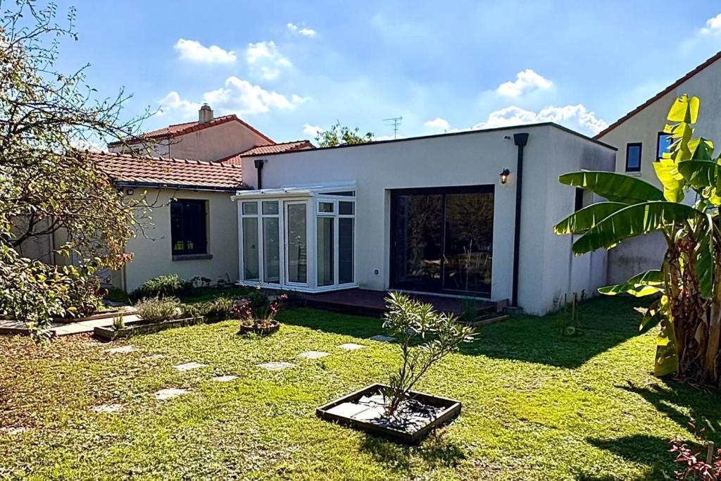 a house with a small garden in the yard at Bright house with garden in Saint-Sébastien-sur-Loire