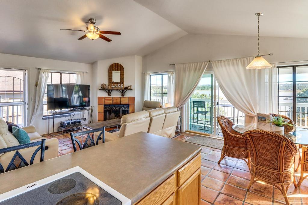 a living room with a couch and a table at Firelit Nights By the Lake Cozy Show Low Retreat in Show Low