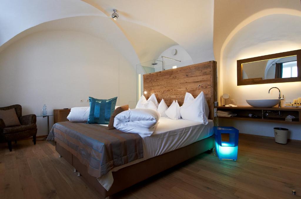 Łóżko lub łóżka w pokoju w obiekcie Hotel Landhaus Moserhof