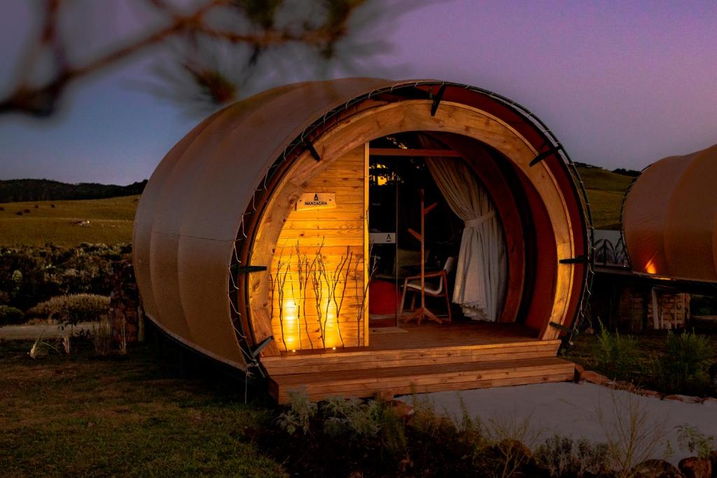 a large dome tent in a field at night at Parador Cambará do Sul in Cambara do Sul