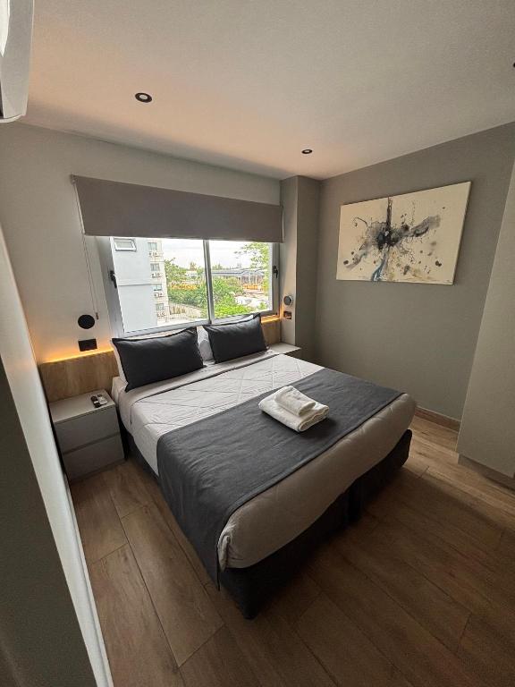 Postel nebo postele na pokoji v ubytování Nuevo Centro Hotel Mendoza