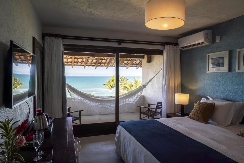 Postel nebo postele na pokoji v ubytování Hotel Maitei