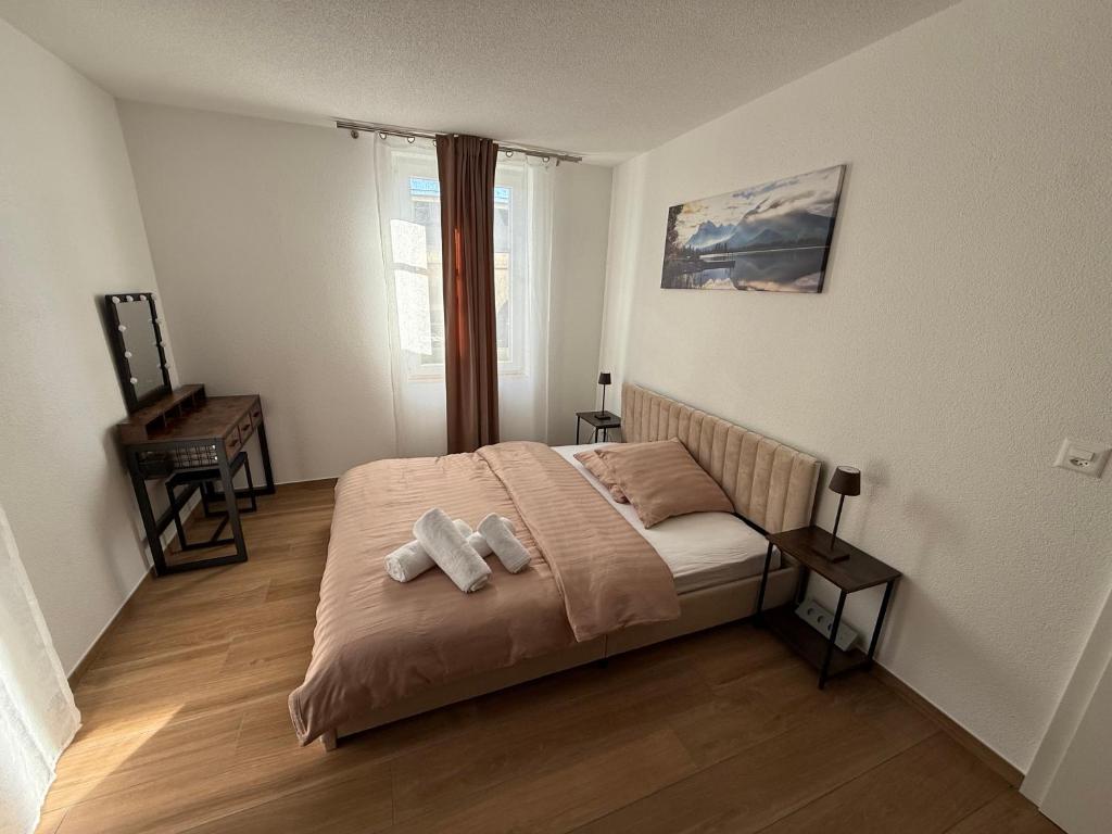 En eller flere senge i et værelse på Family Suite