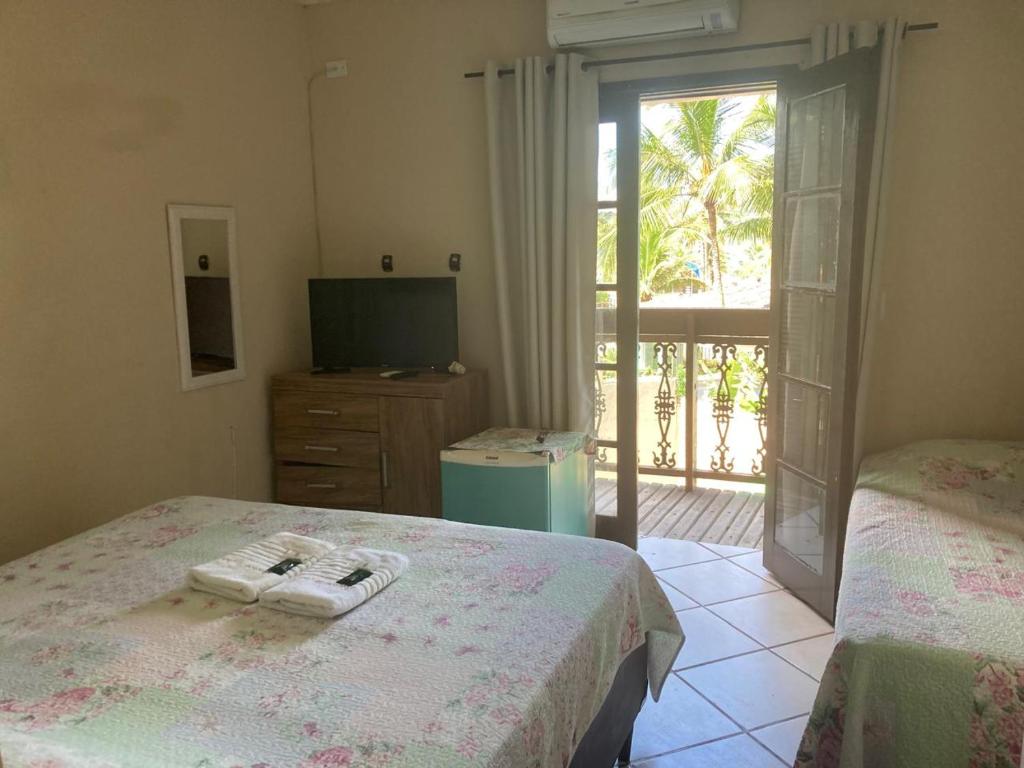 Imagem da galeria de Pousada Reserva do Tombo Lounge Hostel no Guarujá