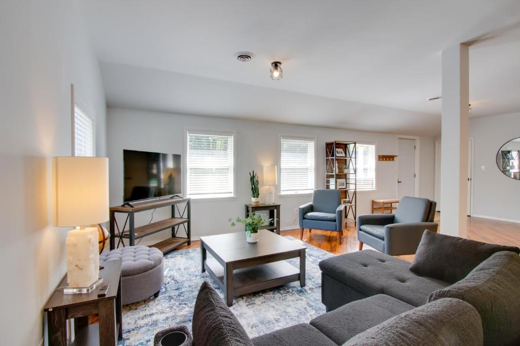 a living room with couches and a tv at Peaceful Country Apt Extended Stays Welcome! in Pataskala