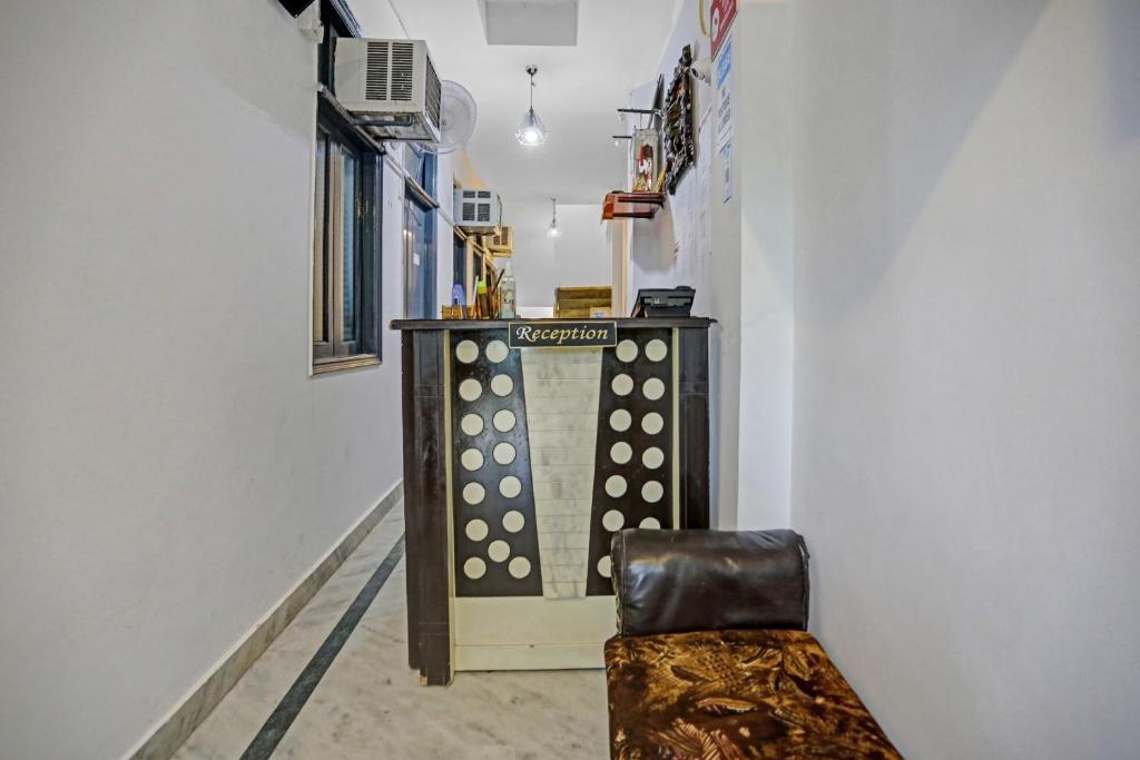 a room with a ping pong table and a chair at Hotel O The Premium Villa in New Delhi