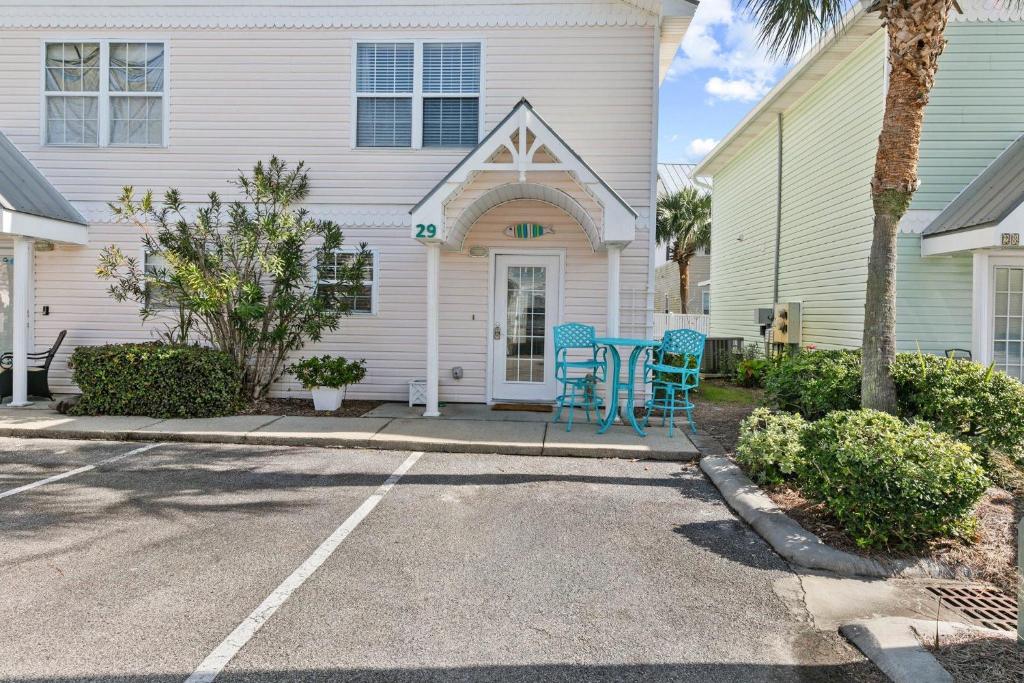 a house with a table and chairs in front of it at Summerlake 29 in Destin