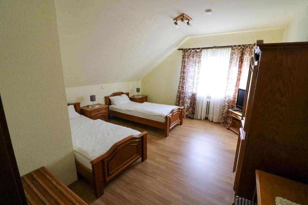 Postel nebo postele na pokoji v ubytování Gästehaus Wildfein