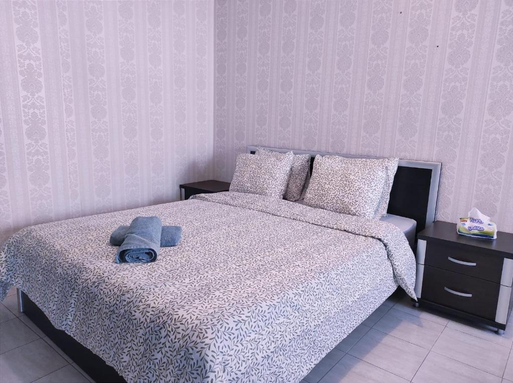 a bedroom with a bed with a stuffed animal on it at heartofrabat in Rabat