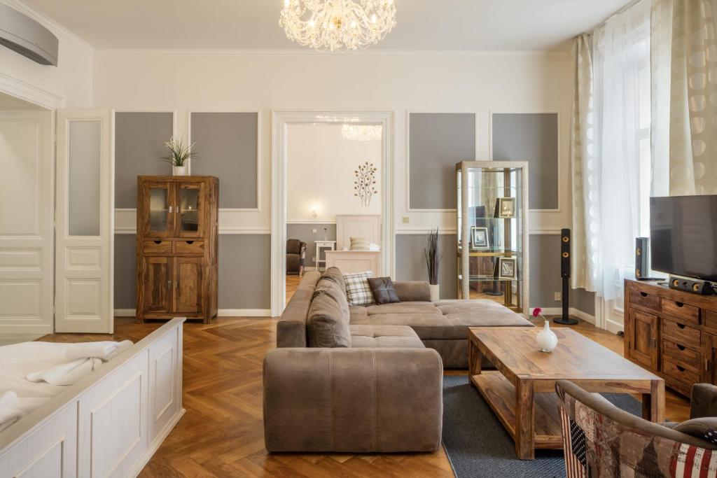 a living room with a couch and a table at Masná 19 - Old Town Residence in Prague