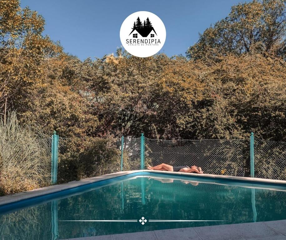 a swimming pool with a sign that reads star photographer at Serendipia Chalet 1 Naturaleza y Pileta in La Cumbre