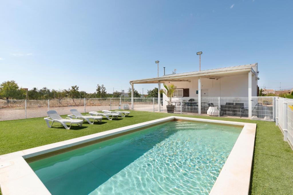 a swimming pool in the backyard of a house at Arizona in Pozo de los Palos