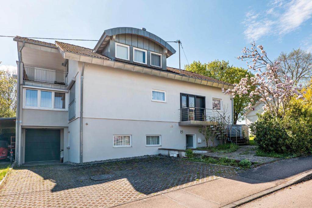 a white house with a dome on the roof at Kocher und Jagst in Michelbach an der Bilz