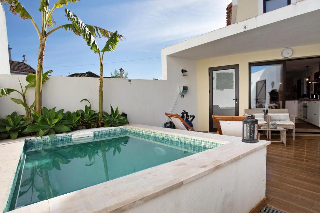 a swimming pool in the backyard of a house at Casa River Sun in Valada
