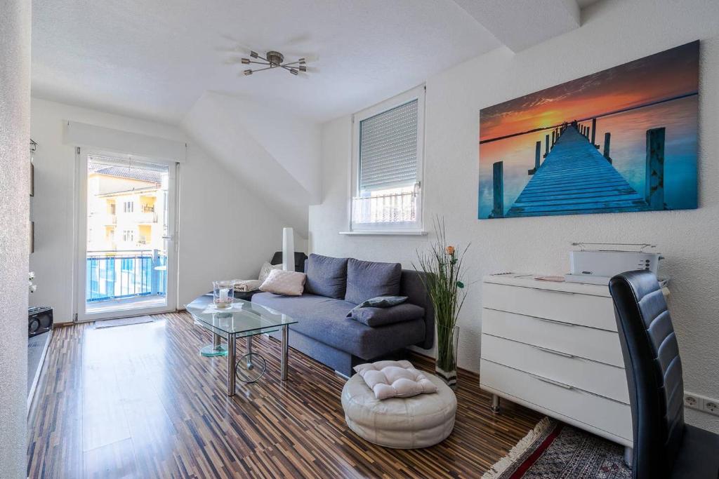 a living room with a couch and a table at Fewo Konstanz City im Paradies in Konstanz