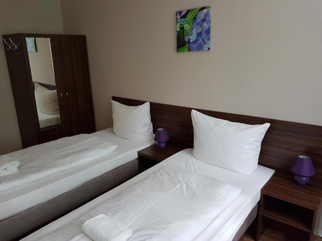 Voodi või voodid majutusasutuse Hotel Pension Eberty toas