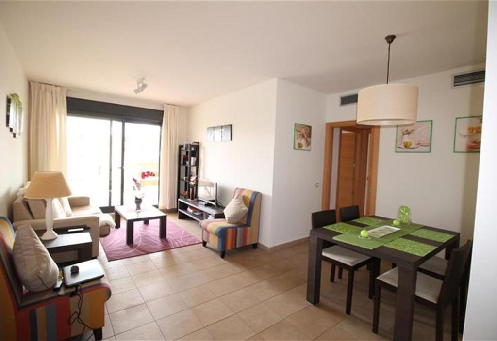 a living room with a table and a couch at Apartment in La Cala de Mijas in La Cala de Mijas