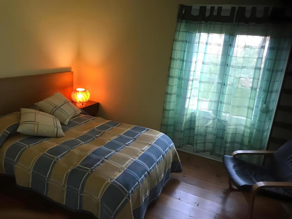 Postel nebo postele na pokoji v ubytování Casa do Bairro