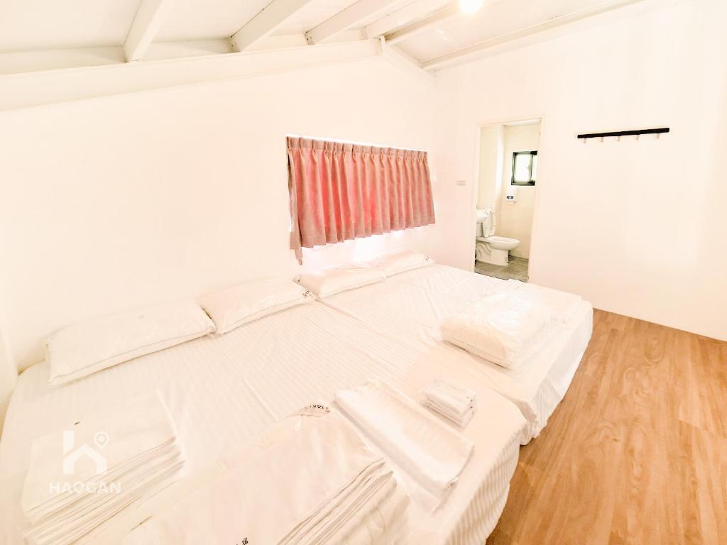 Postel nebo postele na pokoji v ubytování 埔里福興宣安獨棟民宿