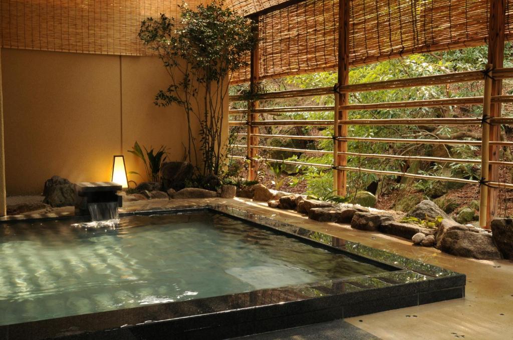 a pool in the middle of a room at Iwaso in Miyajima