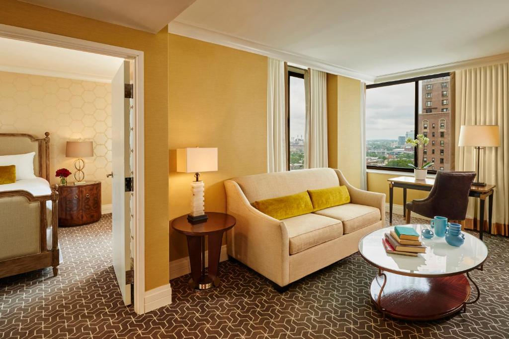 a hotel room with a couch and a bed at The Rittenhouse Hotel in Philadelphia