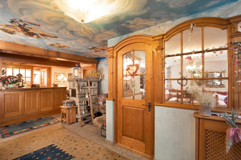 a room with a ceiling with a painting on it at Hotel Romantica in Zermatt